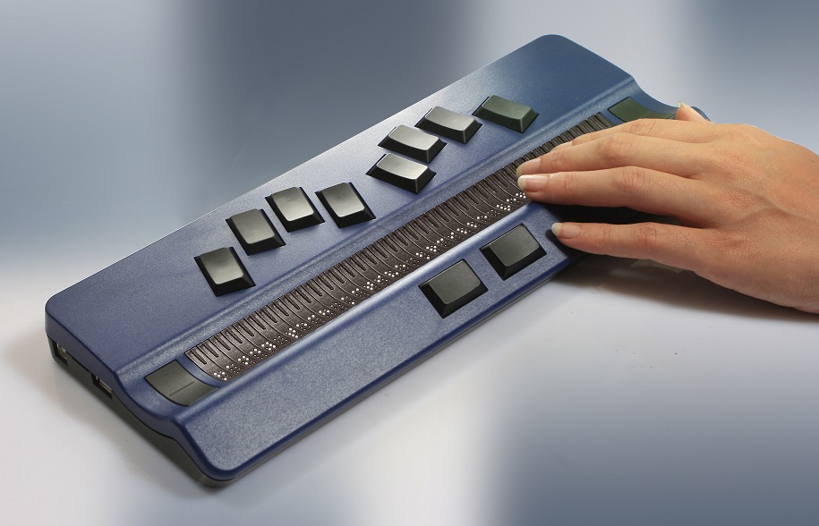 picture showing part of a person using a Active Braille.